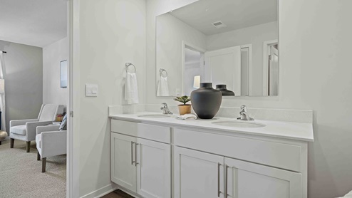 Primary bathroom with standing glass Door shower. New Homes in Kansas City, Missouri