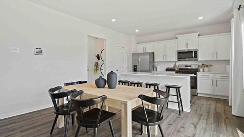 Dining area beside kitchen and living room. New Homes in Kansas City, Missouri