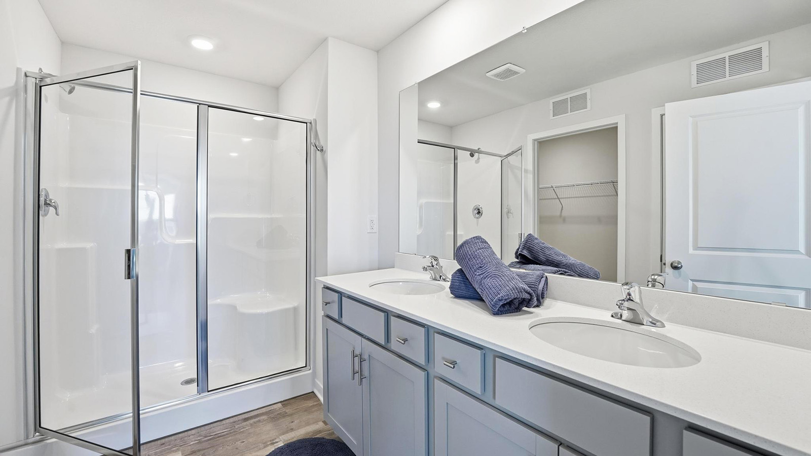 Primary bathroom with standing glass Door shower. New Homes in Kansas City, Missouri