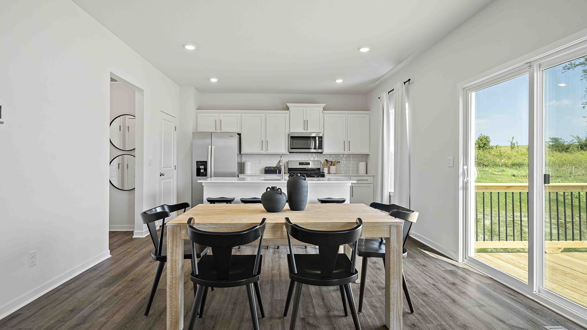 Dining area beside kitchen and living room. New Homes in Kansas City, Missouri