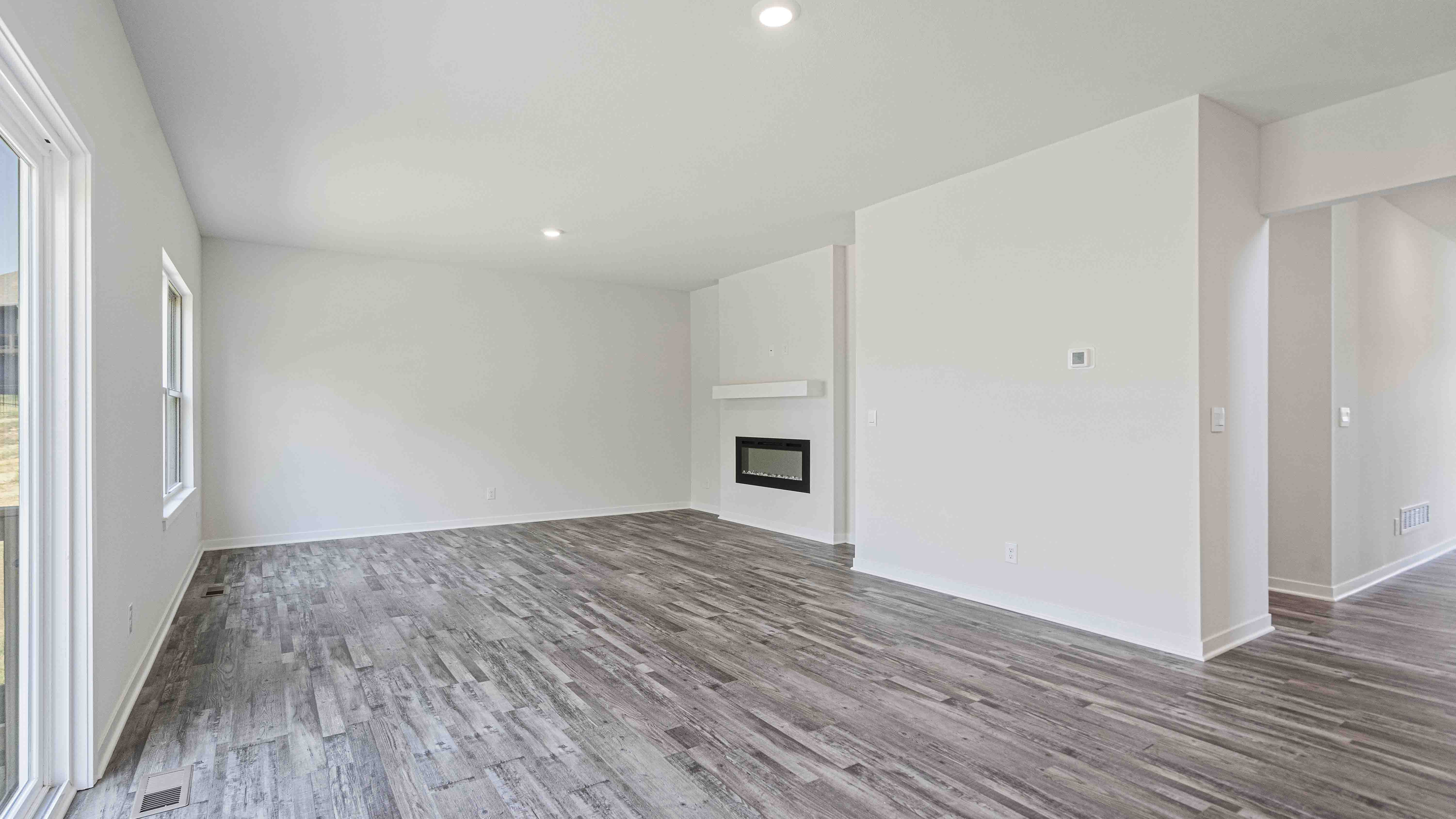 Large family and dining area with sliding glass back door.