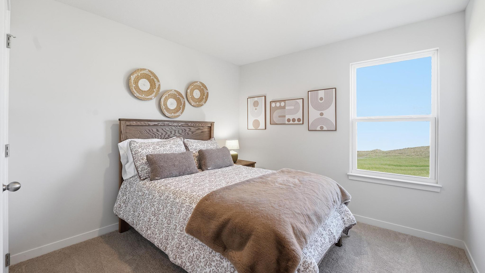 Carpeted bedroom with large windows