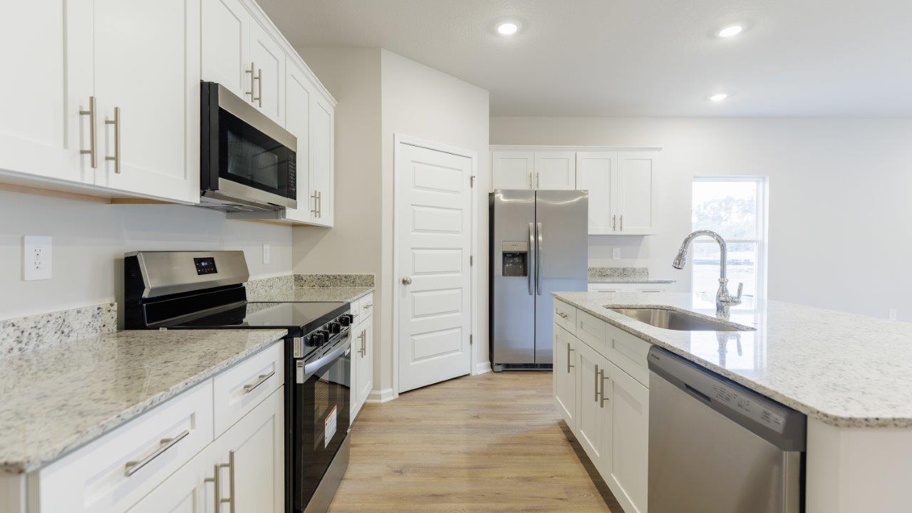 The Ozark features 4 bedrooms, 3 bathrooms, and approximately 2,458 square feet