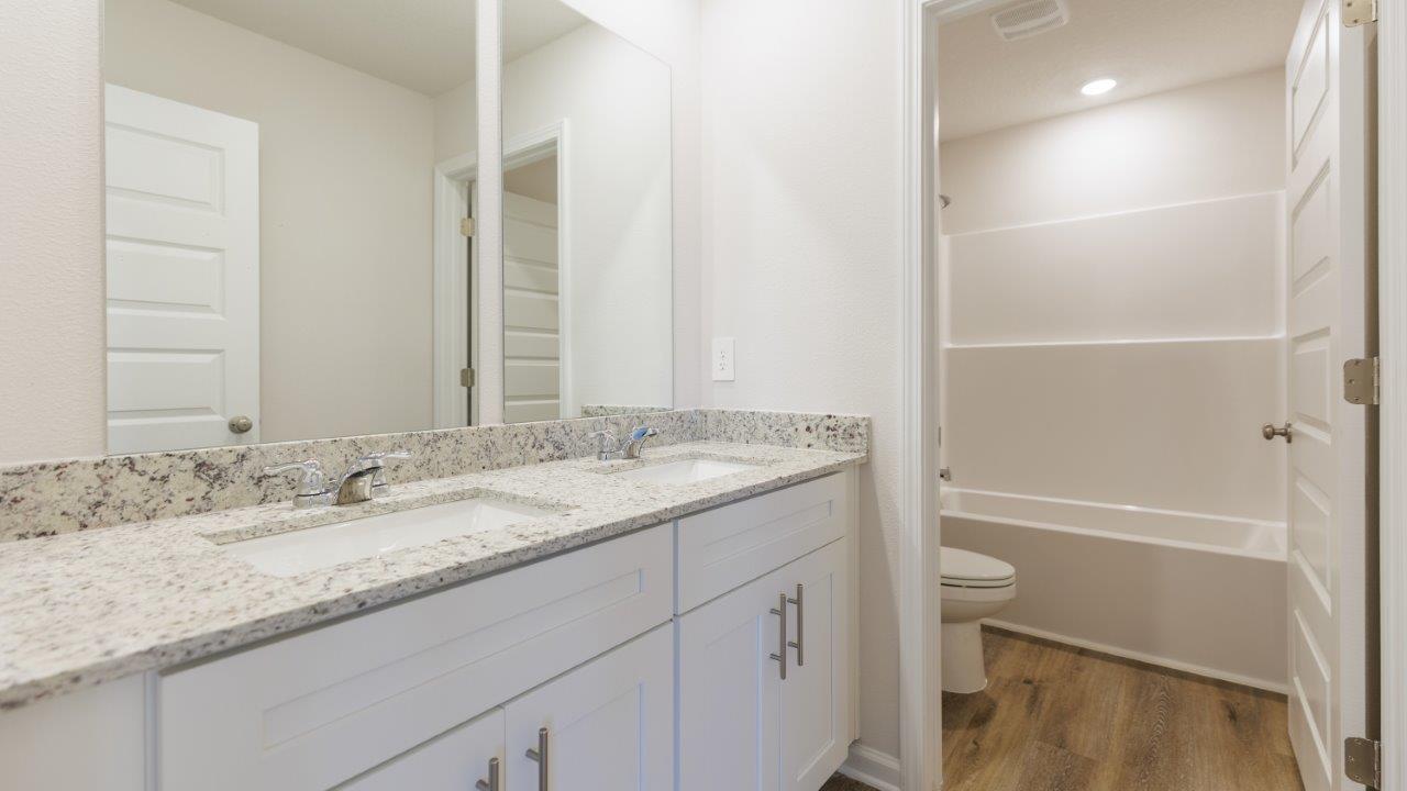 This floorplan features 4 bedrooms, 3 bathrooms, and approximately 2,458 square feet.