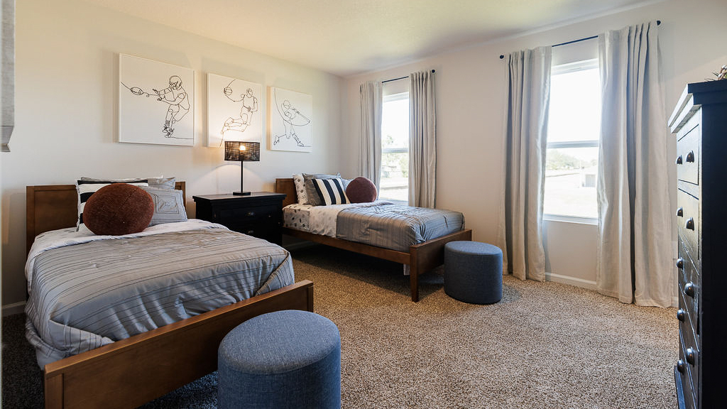 Sports themed bedroom with two twin beds