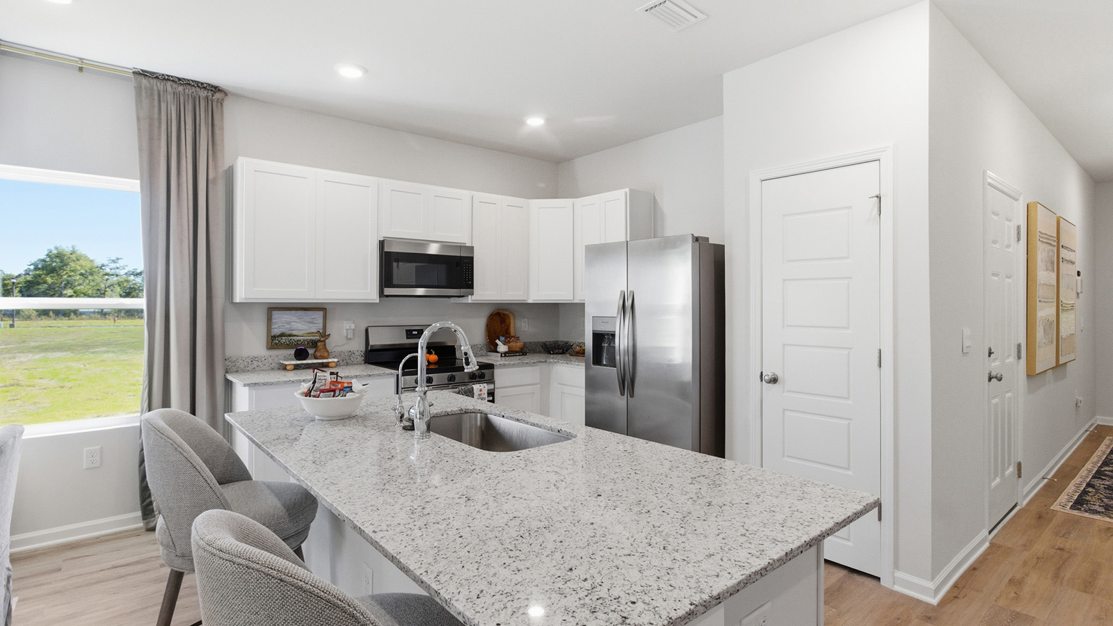 a modern and spacious 3-bedroom 2 ½-bathroom townhome