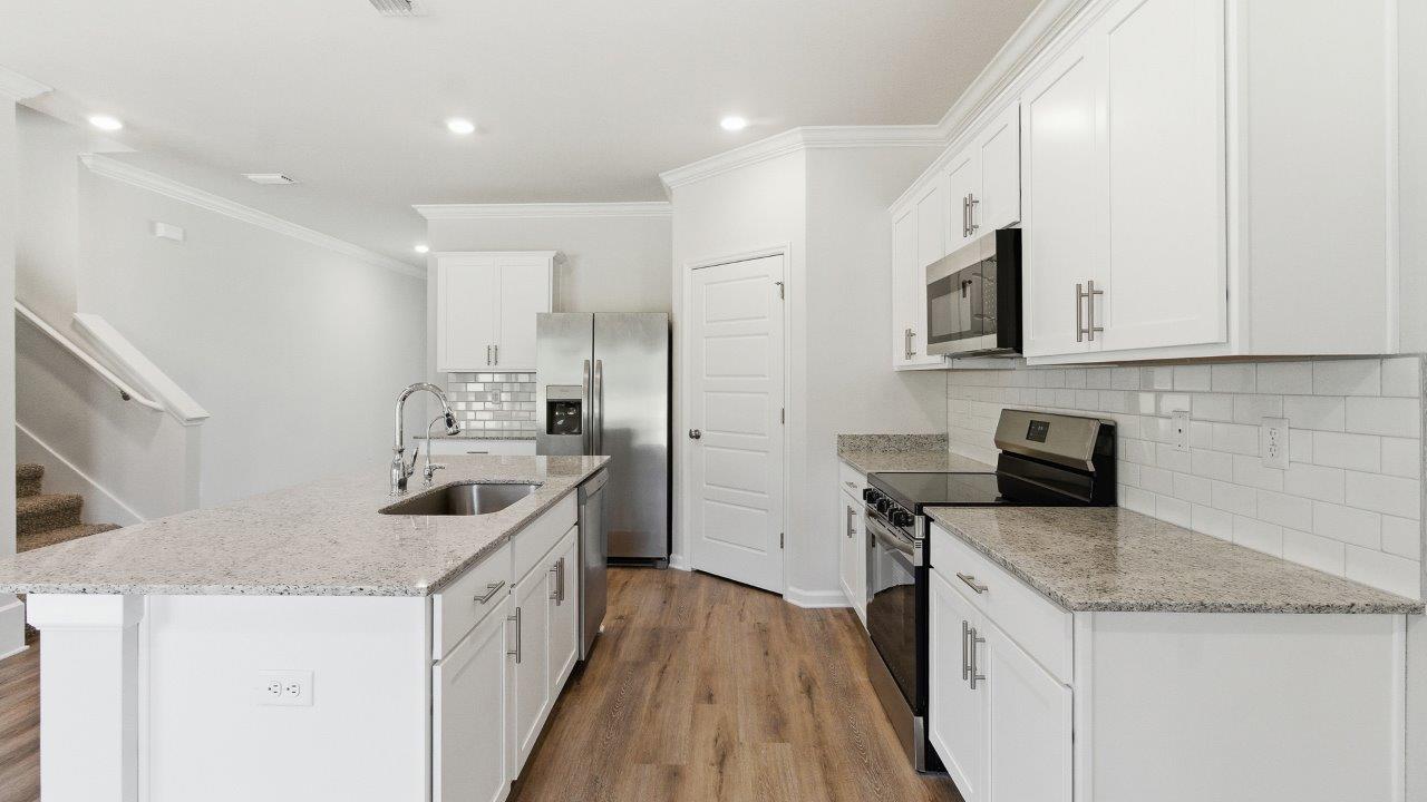 The Carol is a two-story home with 5 bedrooms, 3 bathrooms, and a two-car garage