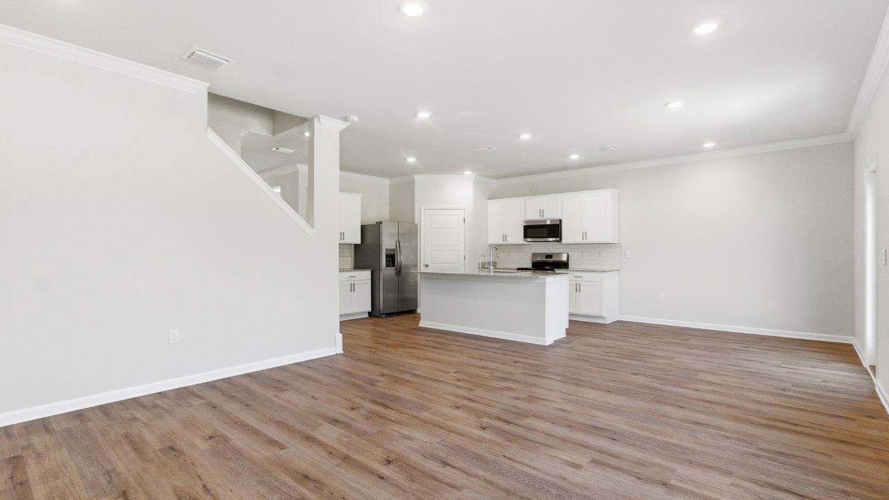 The Carol is a two-story home with 5 bedrooms, 3 bathrooms, and a two-car garage