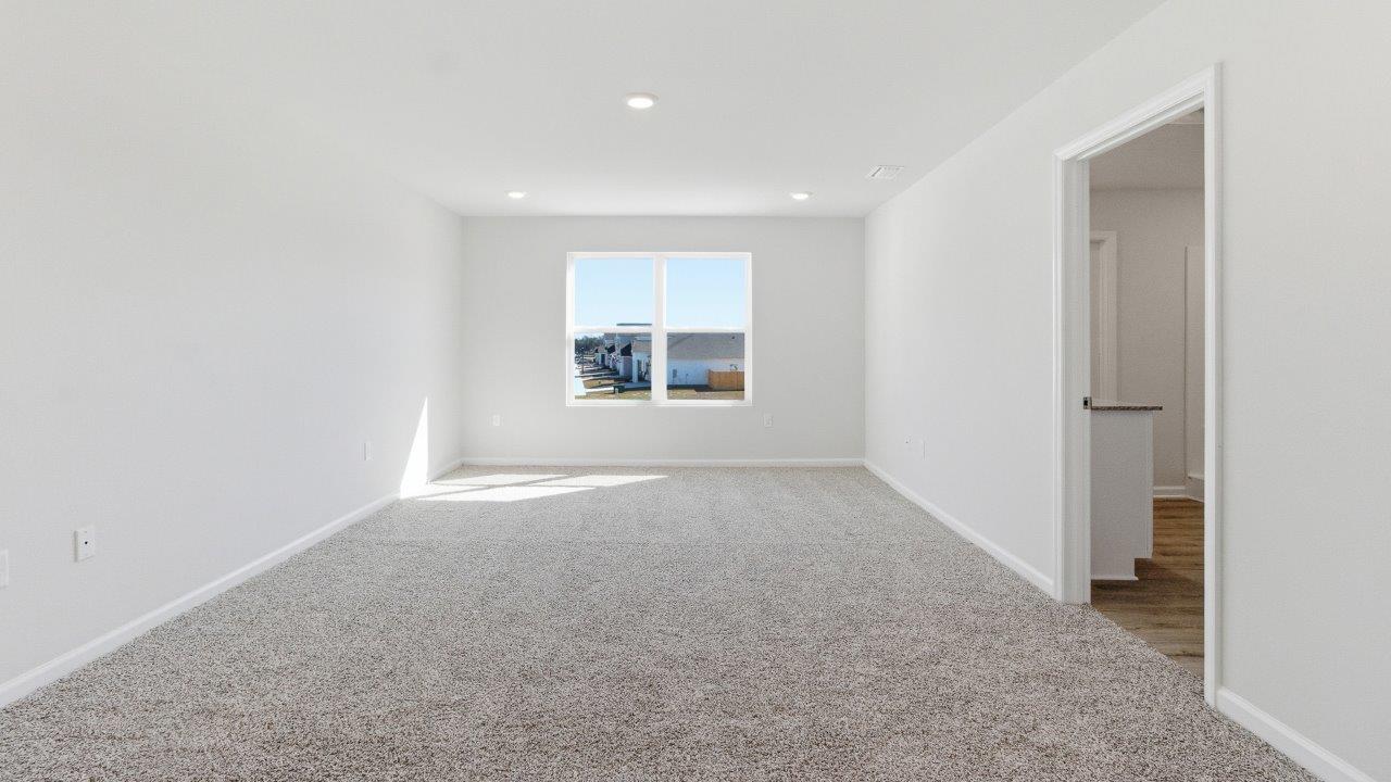 The Carol is a two-story home with 5 bedrooms, 3 bathrooms, and a two-car garage