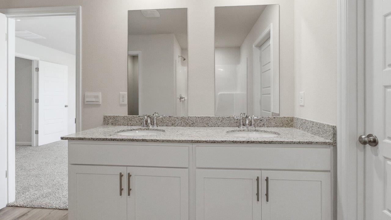 The Carol is a two-story home with 5 bedrooms, 3 bathrooms, and a two-car garage