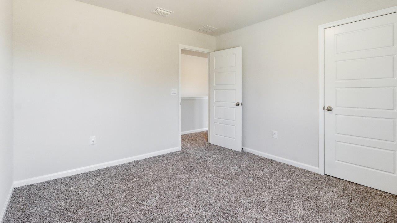 The Carol is a two-story home with 5 bedrooms, 3 bathrooms, and a two-car garage