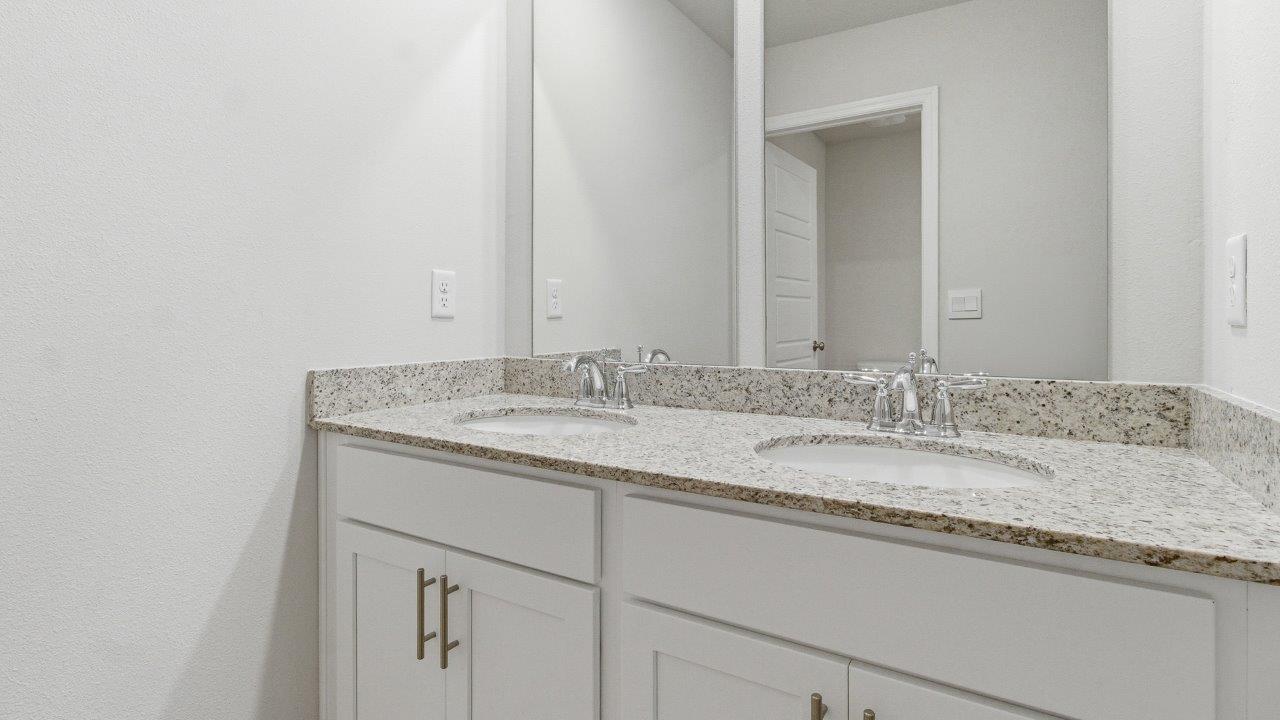 The Carol is a two-story home with 5 bedrooms, 3 bathrooms, and a two-car garage