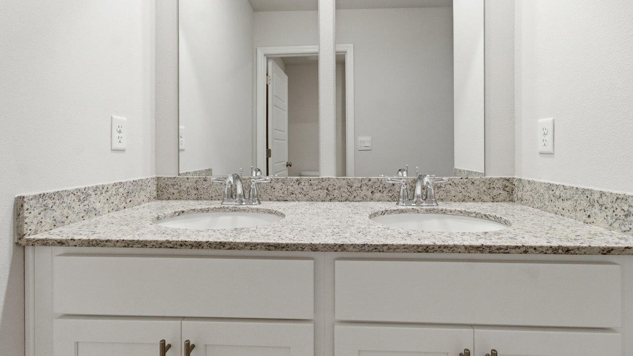 The Carol is a two-story home with 5 bedrooms, 3 bathrooms, and a two-car garage