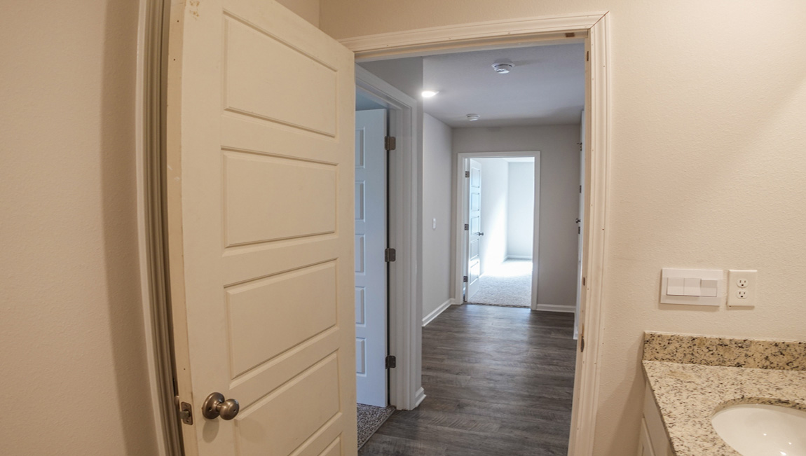 The Lismore plan is a single-story, 3 bed, 2 bath layout, spanning approximately 1,580 square feet