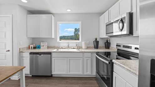 Kitchen in the Callaway with white cabinets