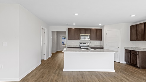 The Lismore plan is a single-story, 3 bedroom 2 bath home, spanning over 1500 square feet of living space! The open concept layout includes a large kitchen, dining room and great room.
