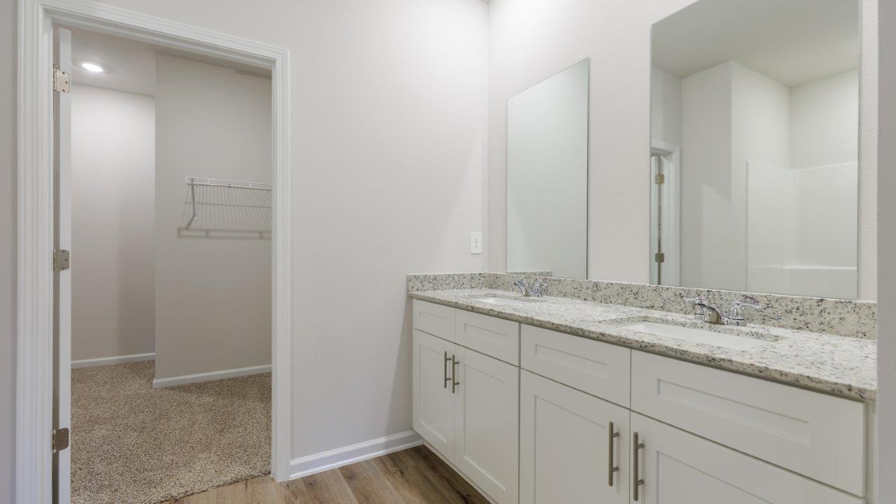 The Ozark floorplan features 4 bedrooms, 3 bathrooms, and approximately 2,458 square feet