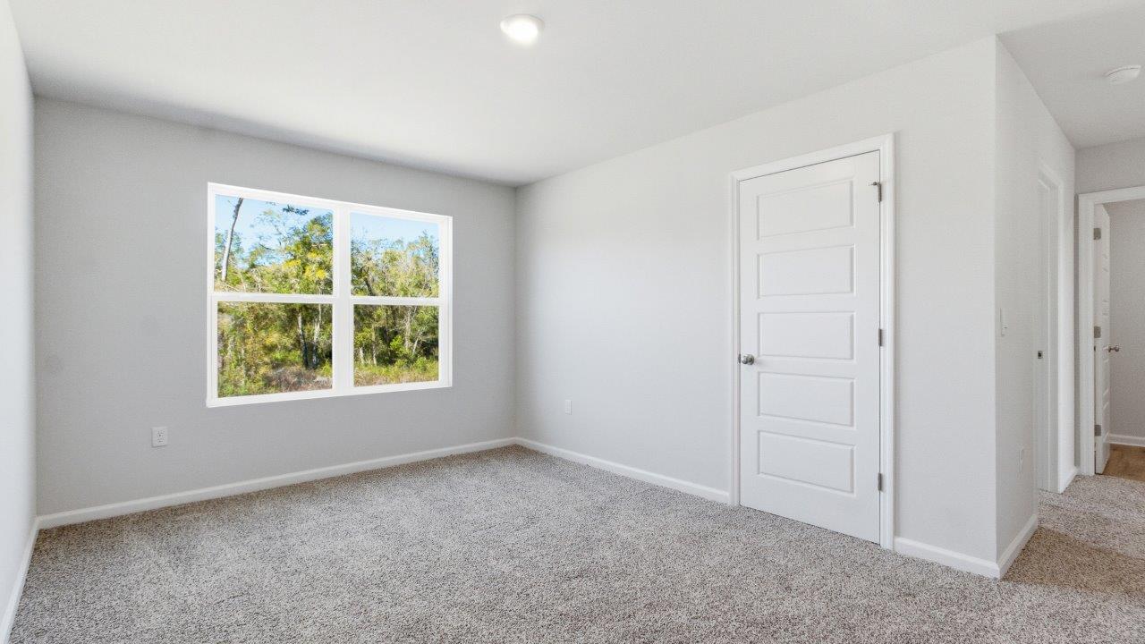a two-story home with 5 bedrooms, 3 bathrooms, and a two-car garage