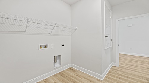 Laundry room with shelving
