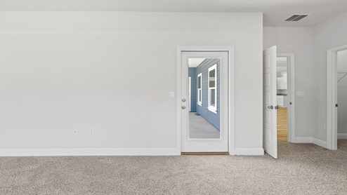Exit to porch from primary bedroom