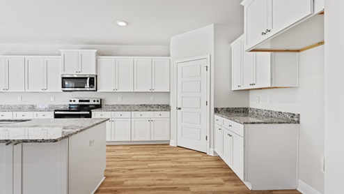 Kitchen with white cabinets