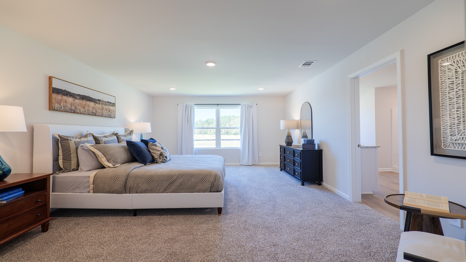 The Carol is a two-story home with 5 bedrooms, 3 bathrooms, and a two-car garage.