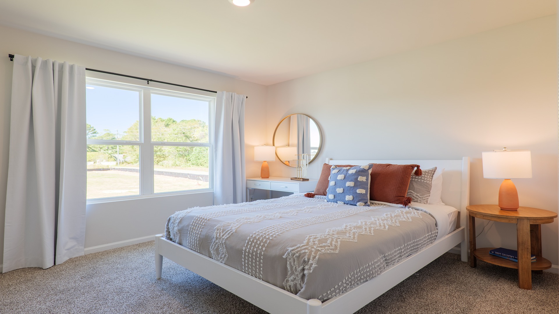 The Carol is a two-story home with 5 bedrooms, 3 bathrooms, and a two-car garage.