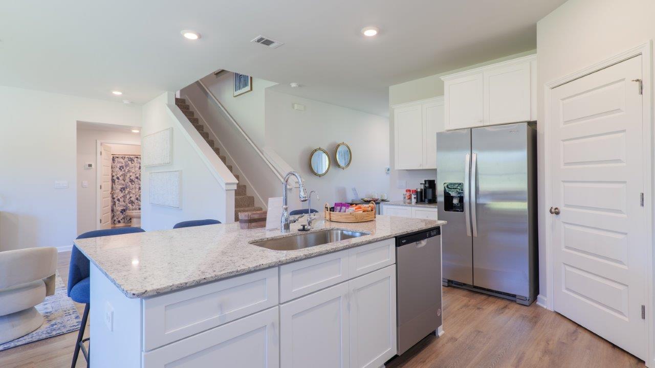 The Carol is a two-story home with 5 bedrooms, 3 bathrooms, and a two-car garage.