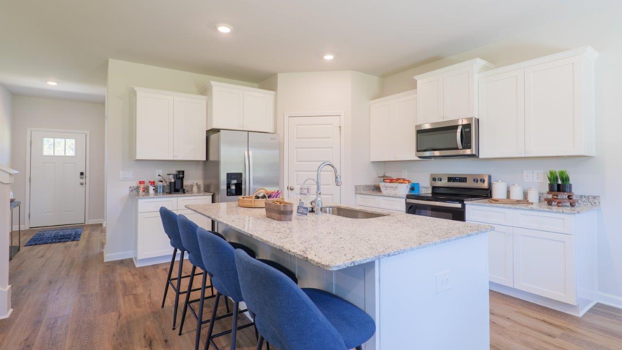 The Carol is a two-story home with 5 bedrooms, 3 bathrooms, and a two-car garage.