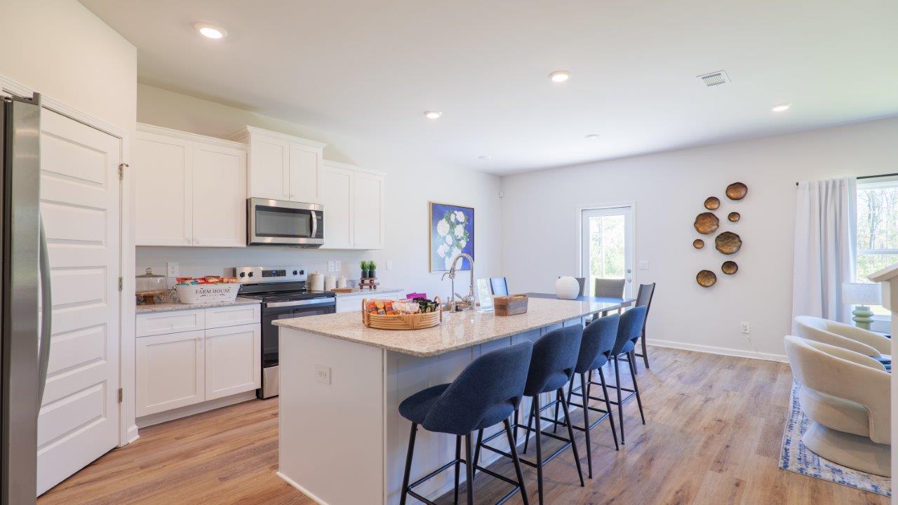 The Carol is a two-story home with 5 bedrooms, 3 bathrooms, and a two-car garage