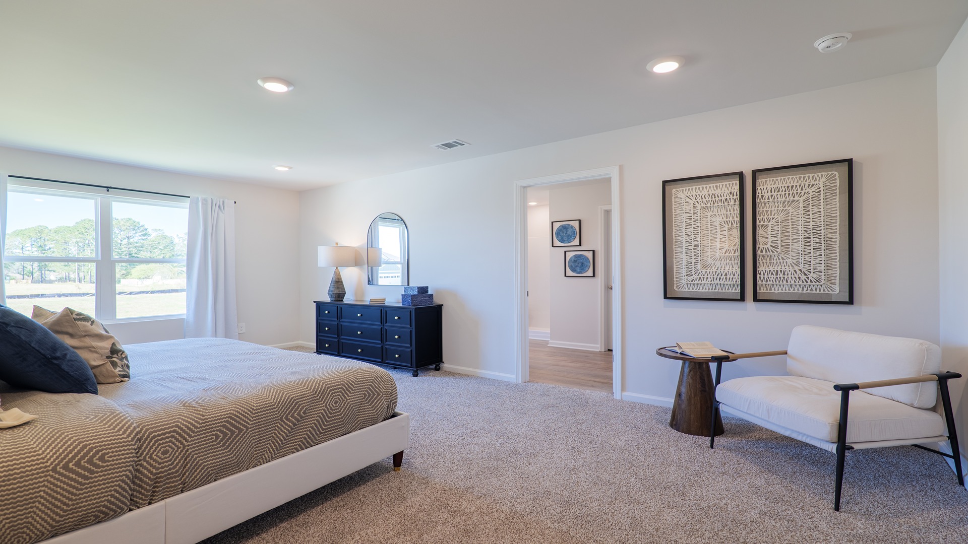 The Carol is a two-story home with 5 bedrooms, 3 bathrooms, and a two-car garage