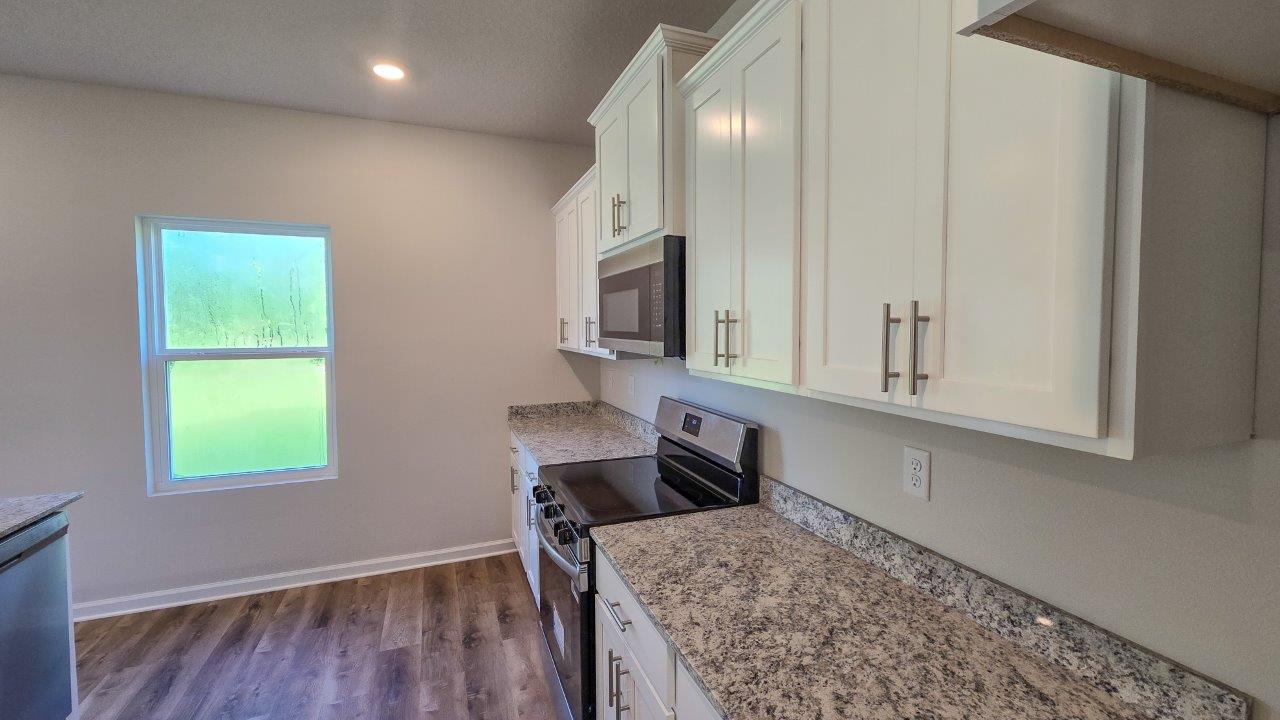 This thoughtfully crafted two-story single-family home offers 2,416 square feet of comfortable, modern living with 4 bedrooms, 2.5 bathrooms