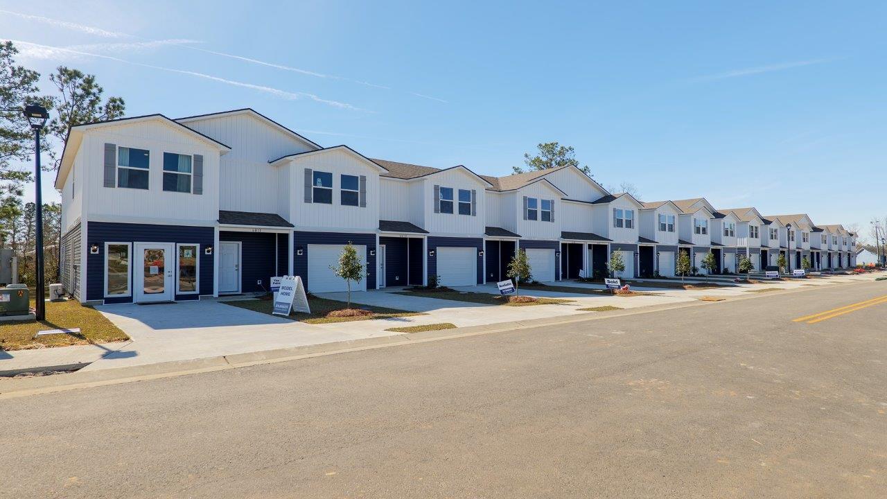 a 3-bedroom, 2 ½-bathroom end-unit townhome with an attached garage