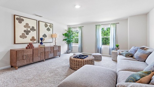 Upstairs living space with games and large couch