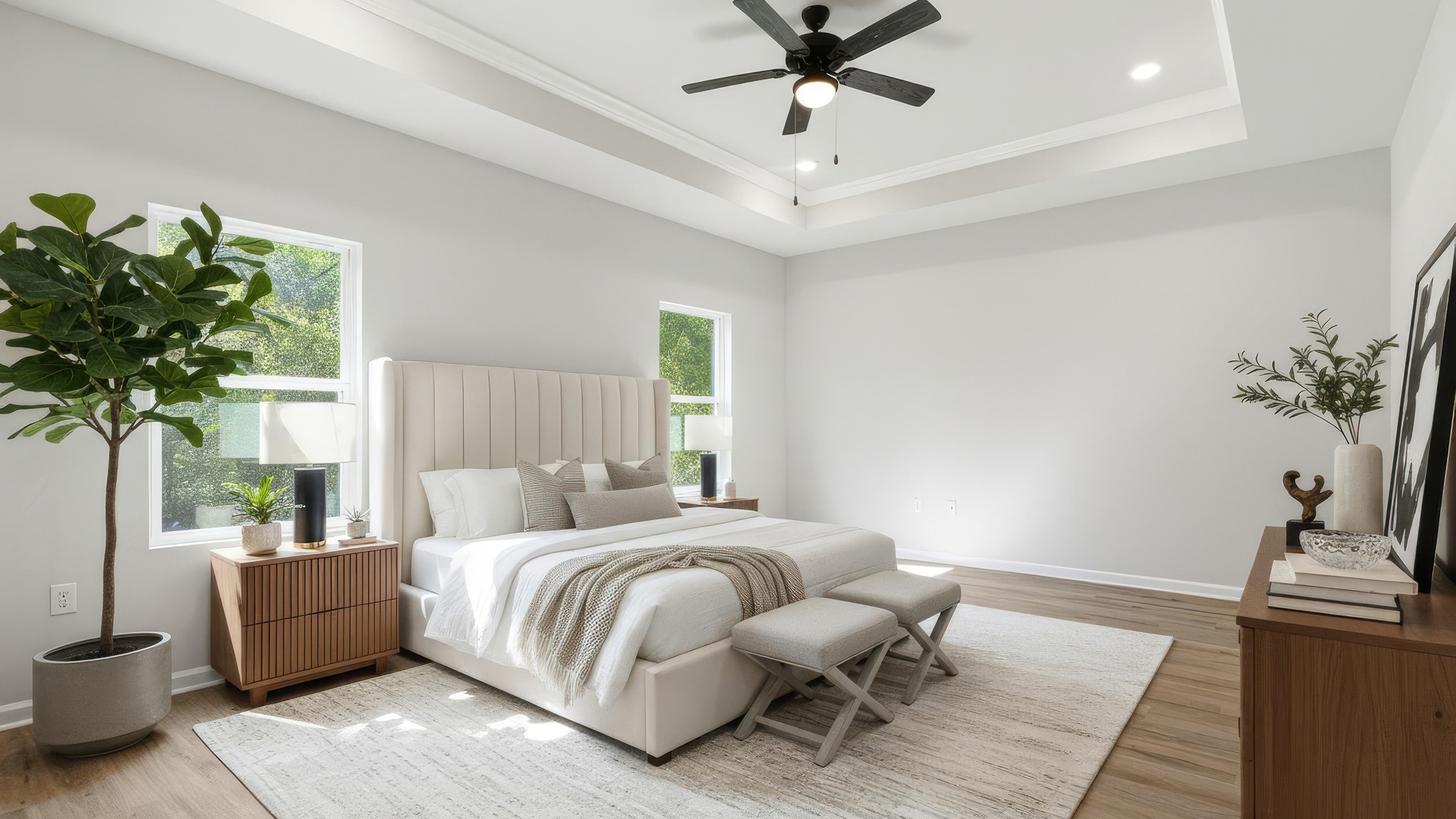 Primary bedroom with tray ceilings