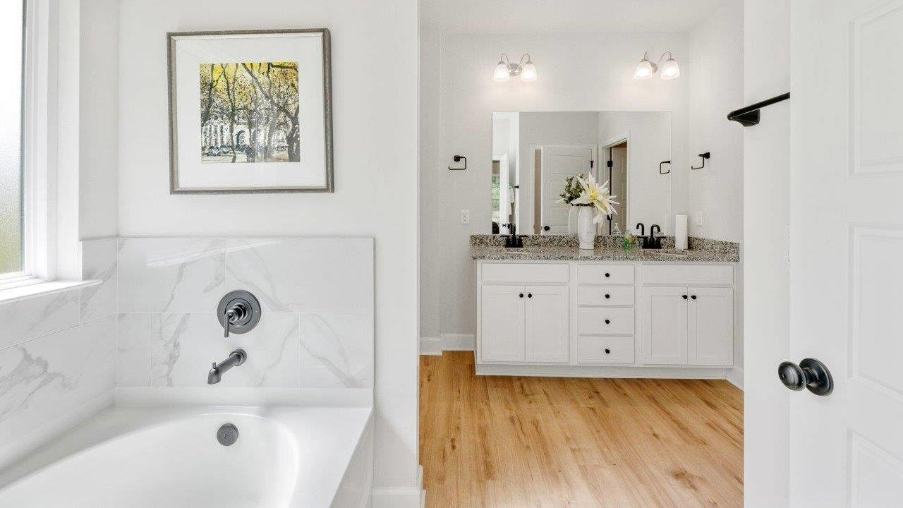 This one-level plan provides a spacious, 4-bedroom, 2 bath design in 1,799 square feet