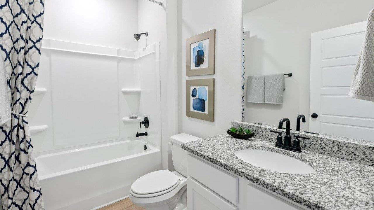 This one-level plan provides a spacious, 4-bedroom, 2 bath design in 1,799 square feet