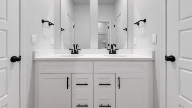 second and third bedroom bathroom with dual vanities