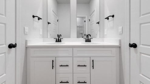 second and third bedroom bathroom with dual vanities