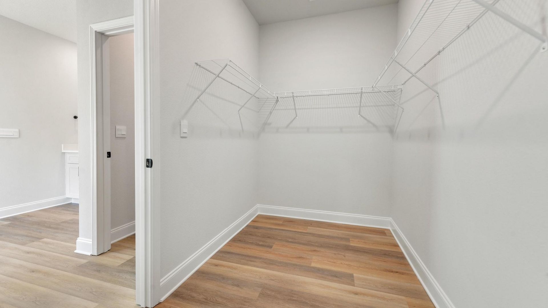 spacious walk-in closet in primary bedroom