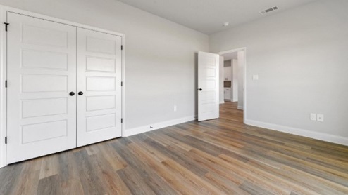 guest bedroom with hardwood floors