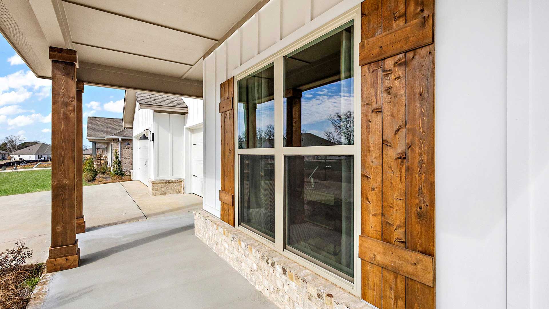 Front Covered Door and porch of this new residence brings you home with well-crafted and designed living areas