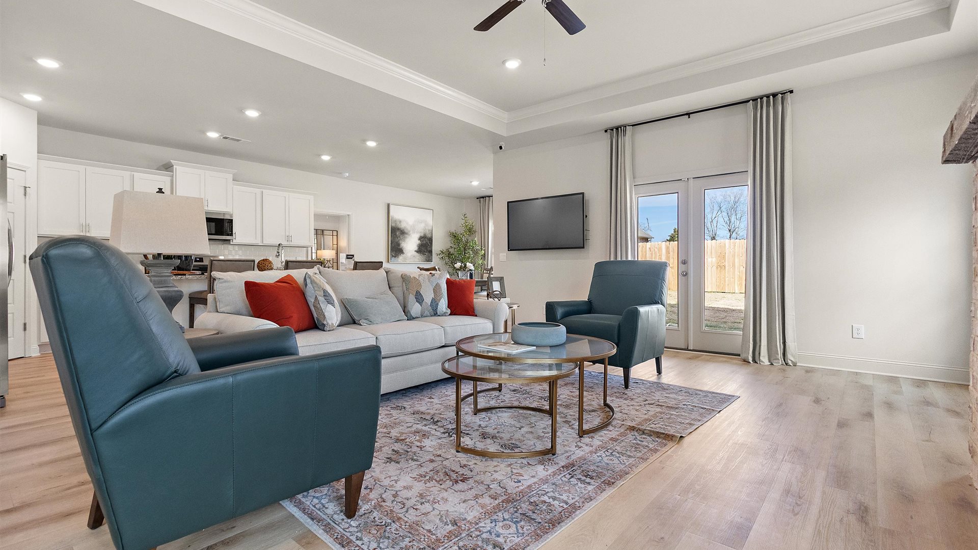 New home living room with modern design details, near front entry adding connectivity for daily flexibility