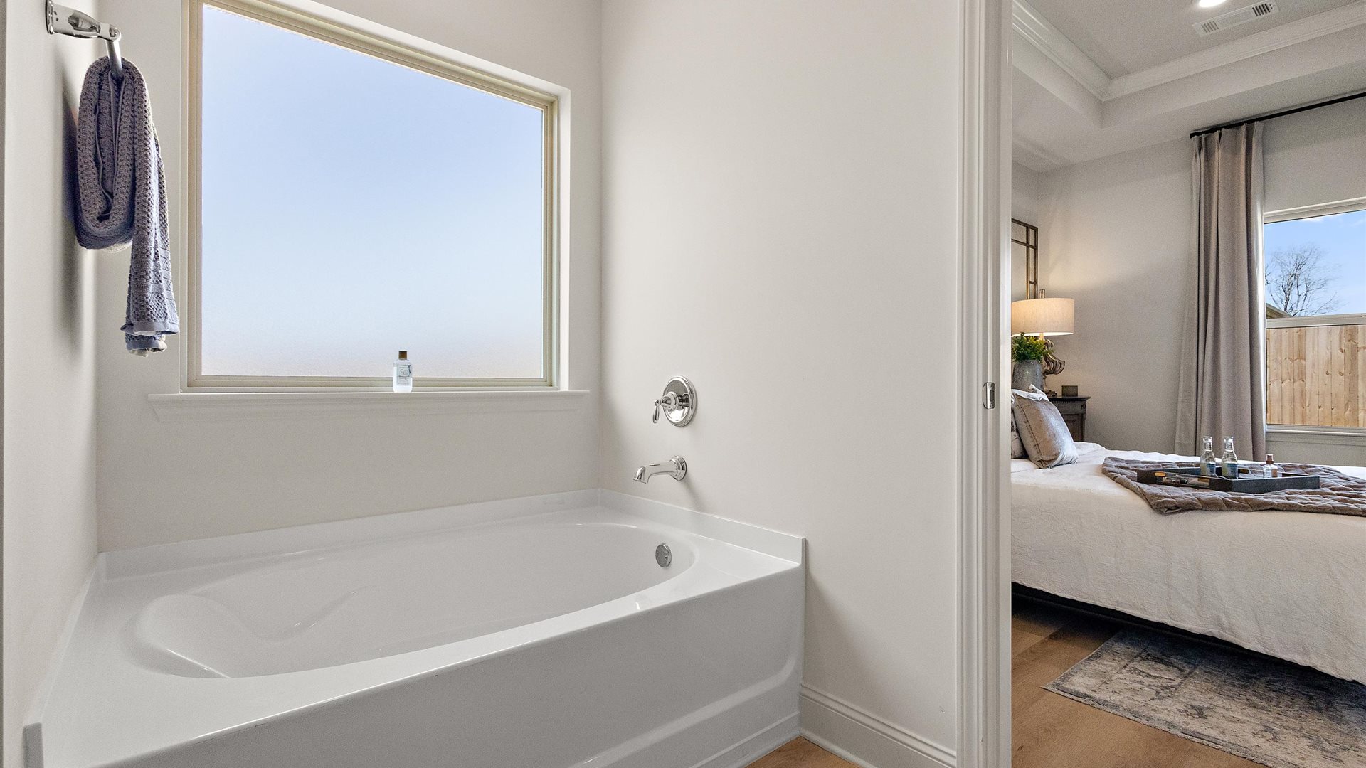 Owner’s en suite is a spa-inspired design, access to the primary bedroom, walk-in shower, walk-in closet
