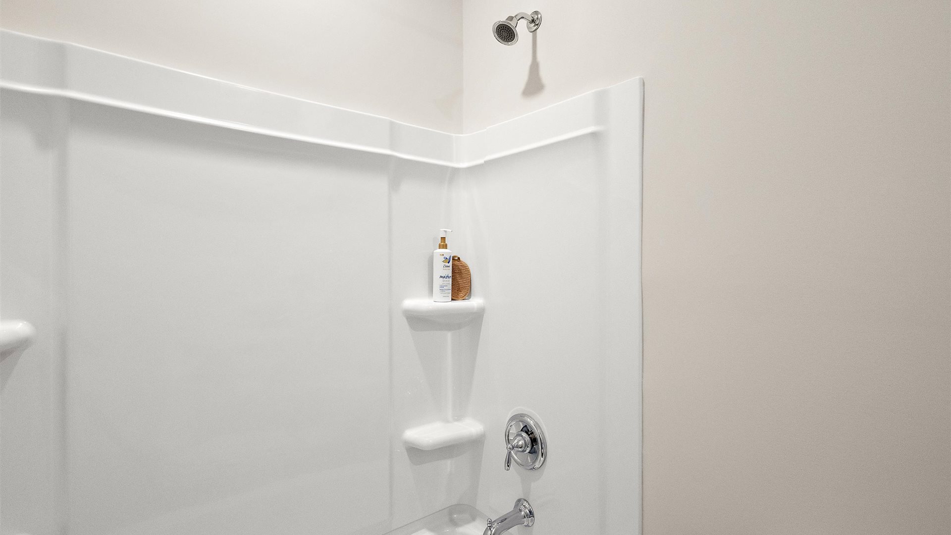 Sleek family-guest bath with single sink, mirror, cabinets, and shower-tub combination