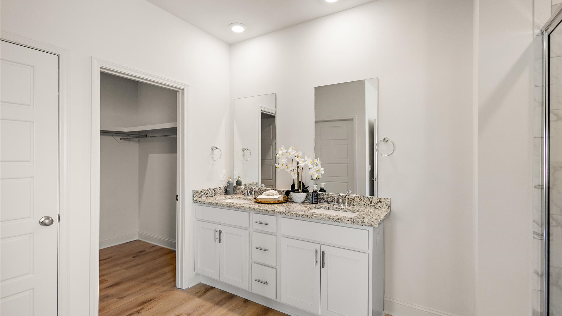 Owner’s en suite adds stylish appeal, spa-inspired design, adds walk-in shower, double vanity, walk-in closet access Owner’s en suite stylish appeal, spa-inspired design, adds a soaking tub, double vanity and walk-in closet access