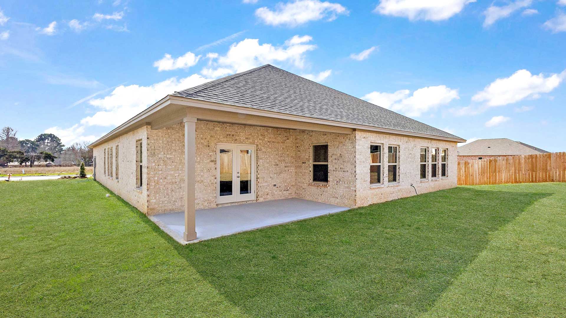 Backyard adds concrete patio for seating, grill setup, and smooth indoor-outdoor transition Horseshoe Bend By D.R. Horton