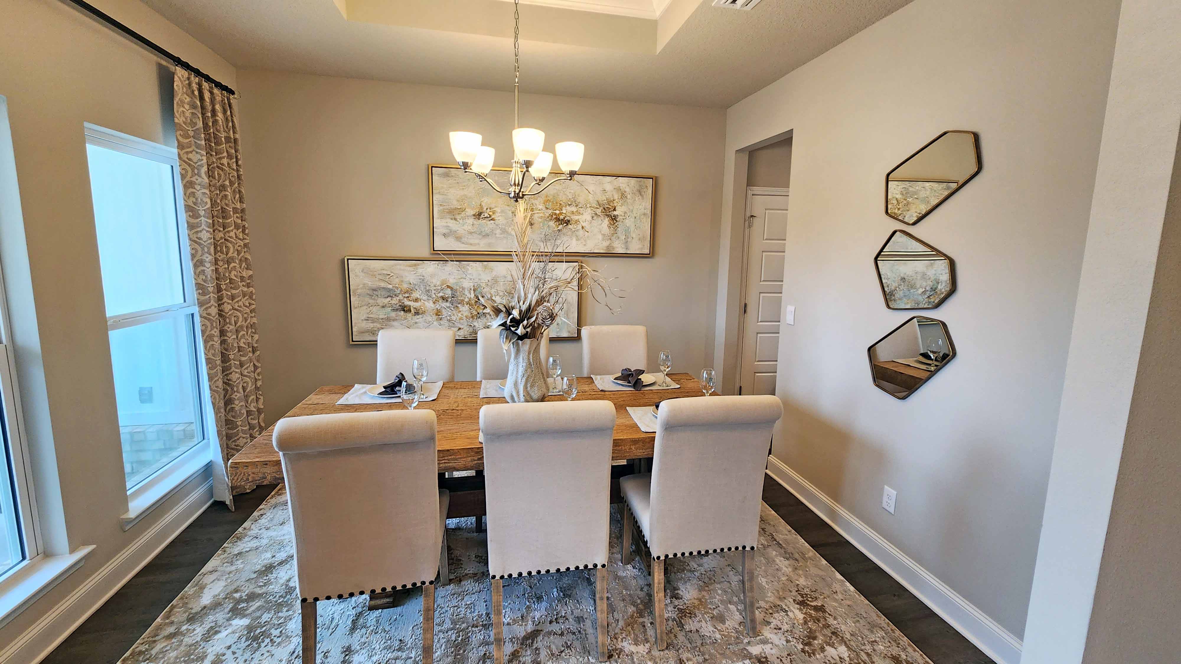 dining room with hardwood floors and windows for natural light