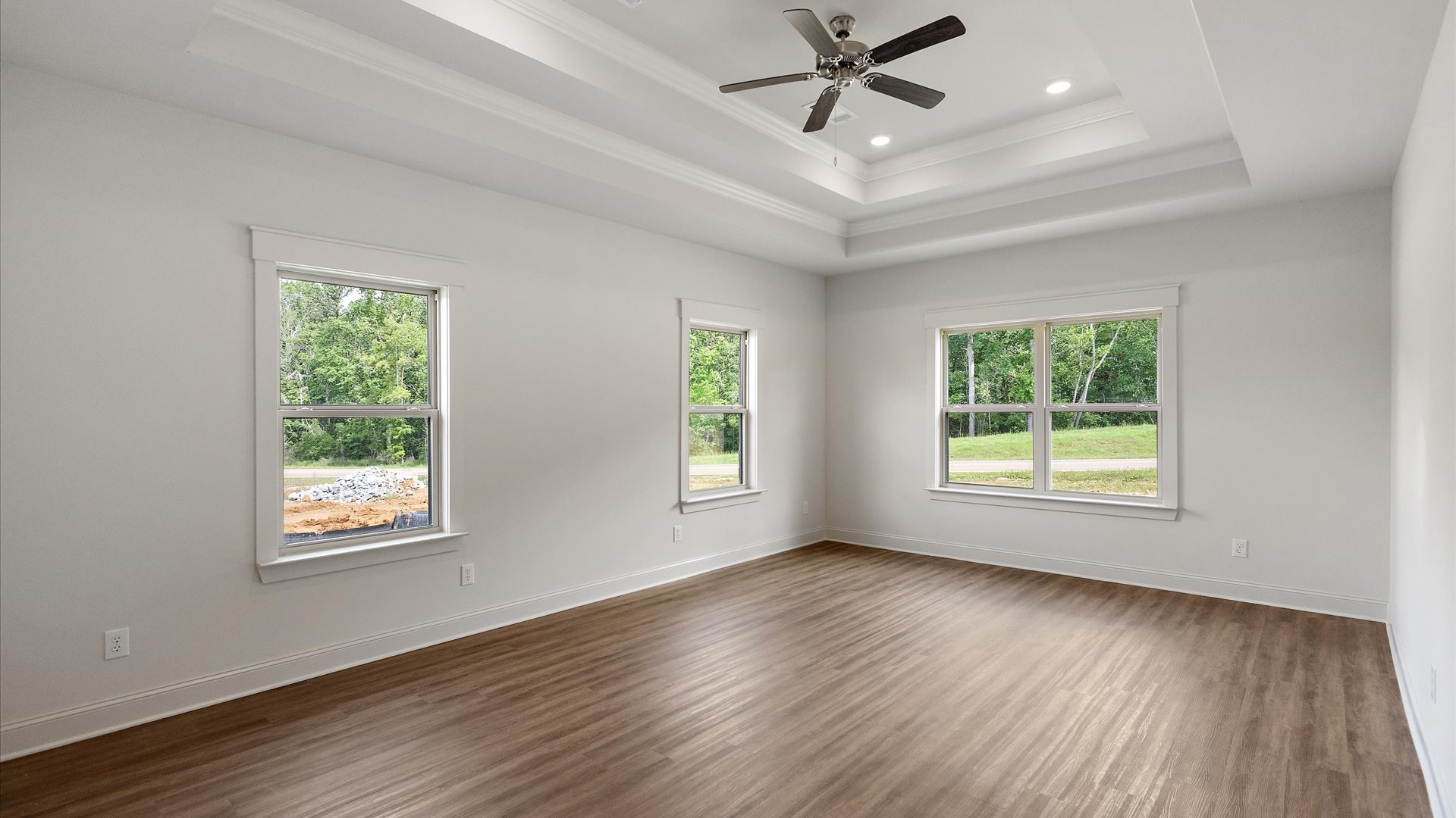 Interior bedroom with multiple big windows