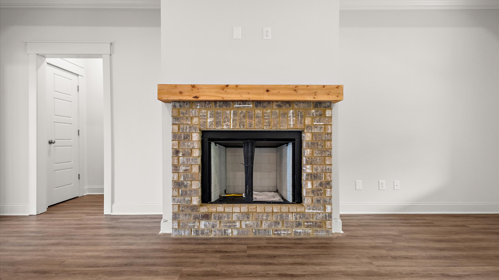 Interior living room with brick fireplace